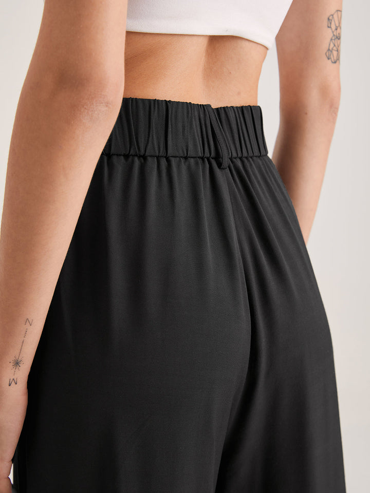 Pantalon ample taille haute plissé