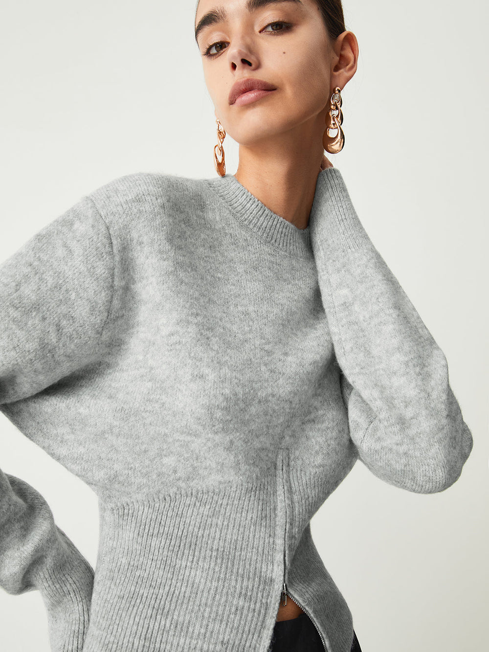 Pull col zippé flou