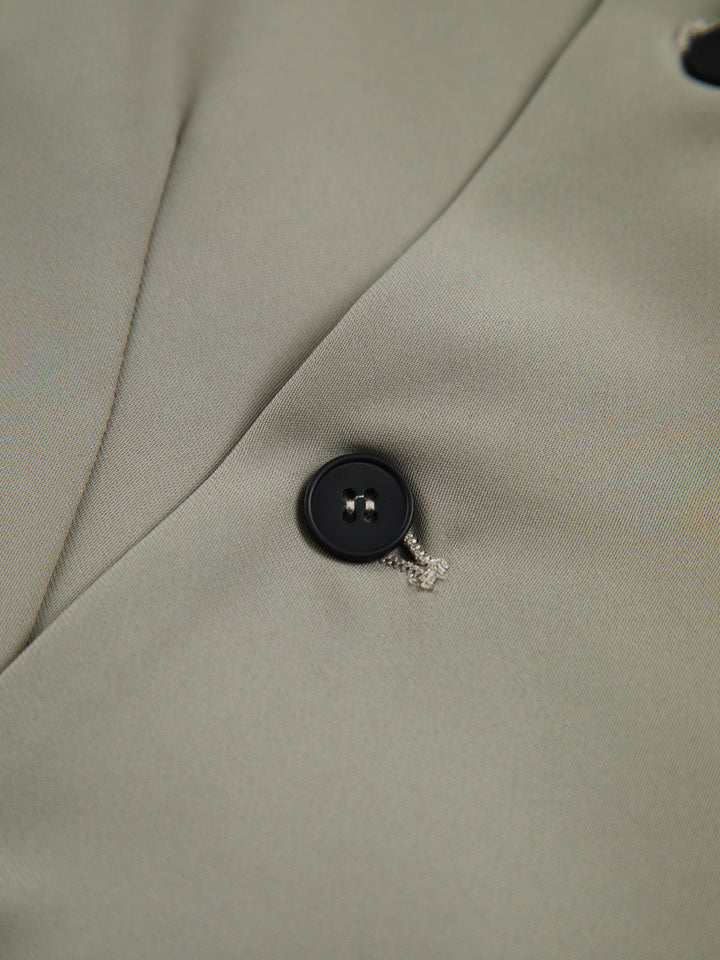 Gilet sans manches asymétrique vert grisâtre avec bouton