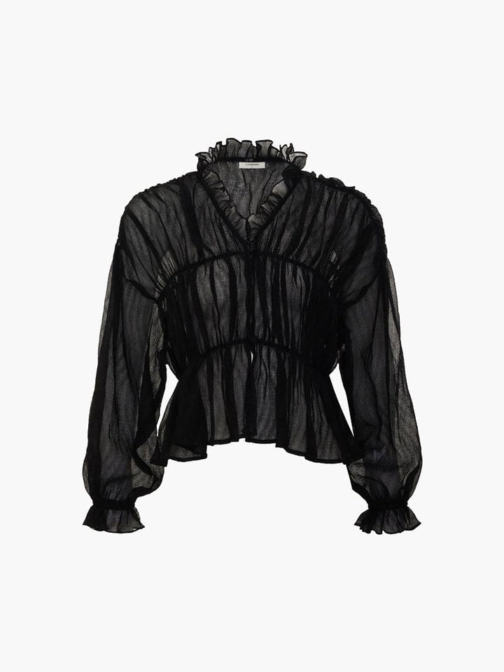 Blouse en mousseline transparente à volants