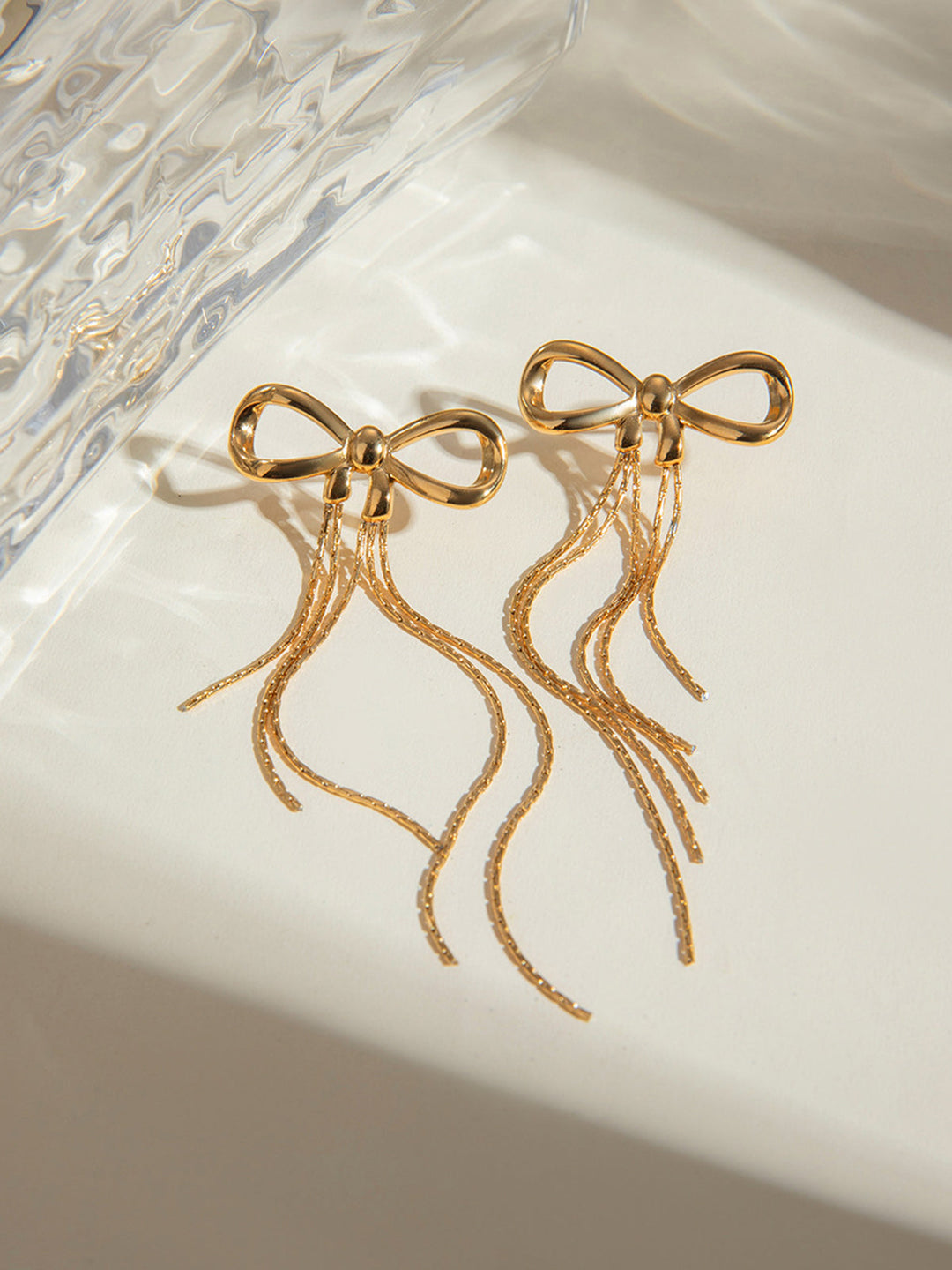 Boucles d'oreilles nœud doré