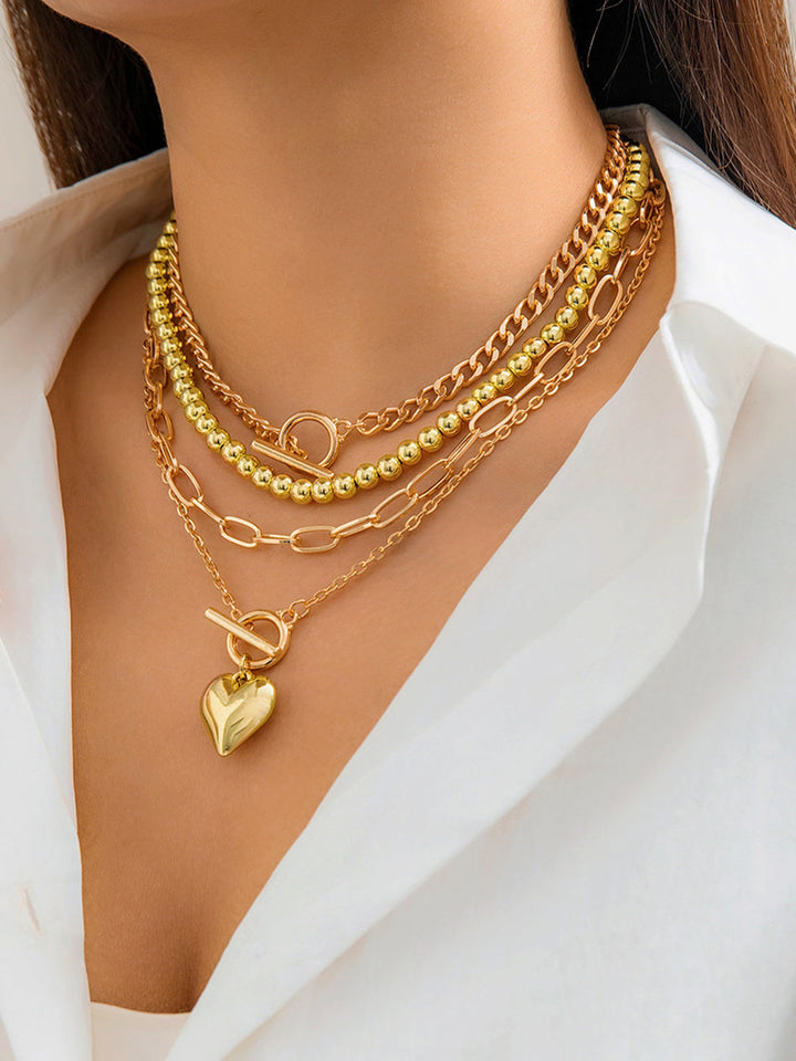Collier avec pendentif en cœur et chaîne multiple