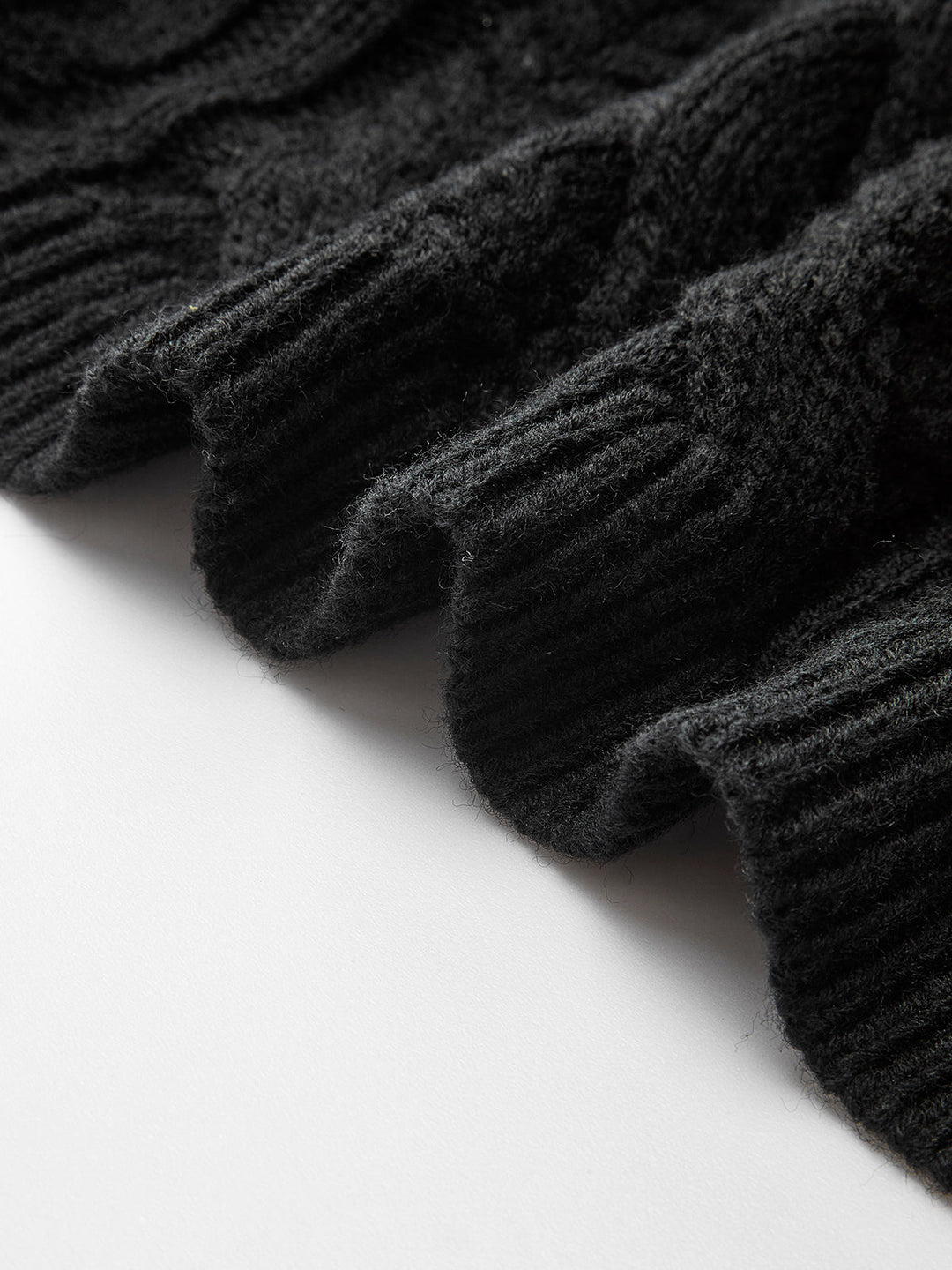 Cardigan en tricot côtelé noué avec un nœud