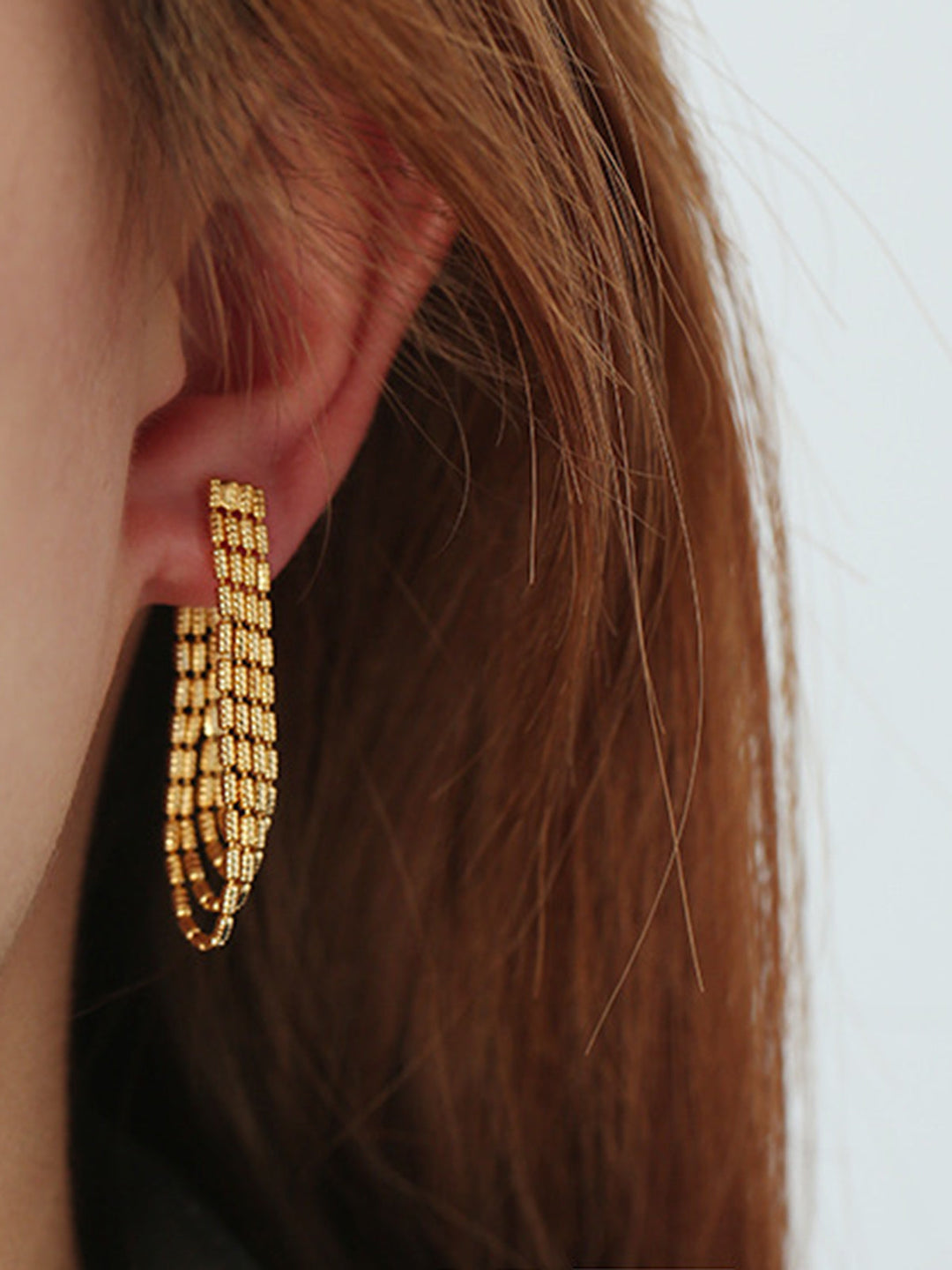 Boucles d'oreilles pendantes à chaîne avec glands dorés
