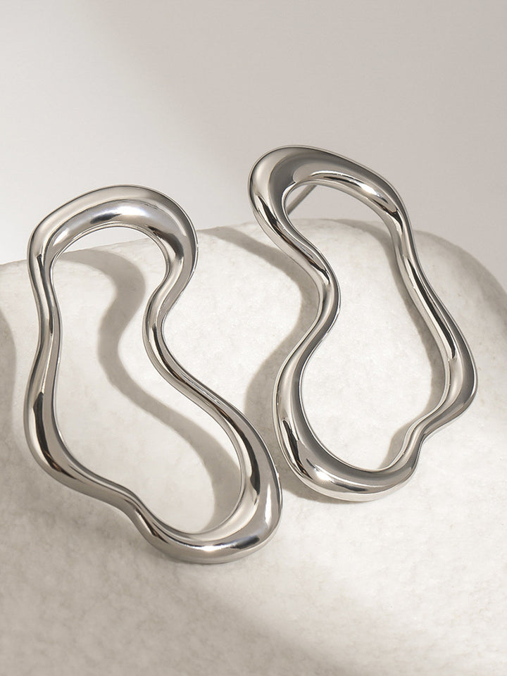 Boucles d'oreilles irrégulières en métal avec clous