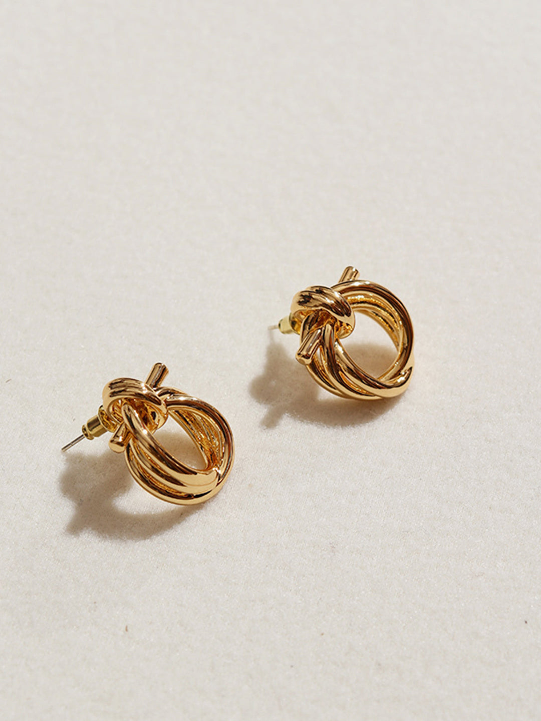 Boucles d'oreilles Nœud Doré