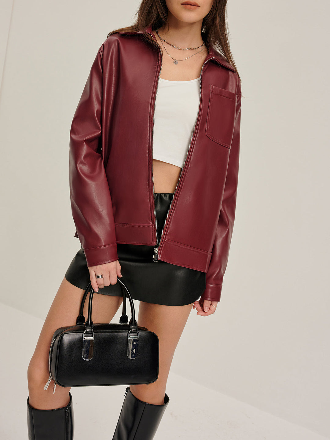 Veste en cuir synthétique à fermeture éclair sur le revers