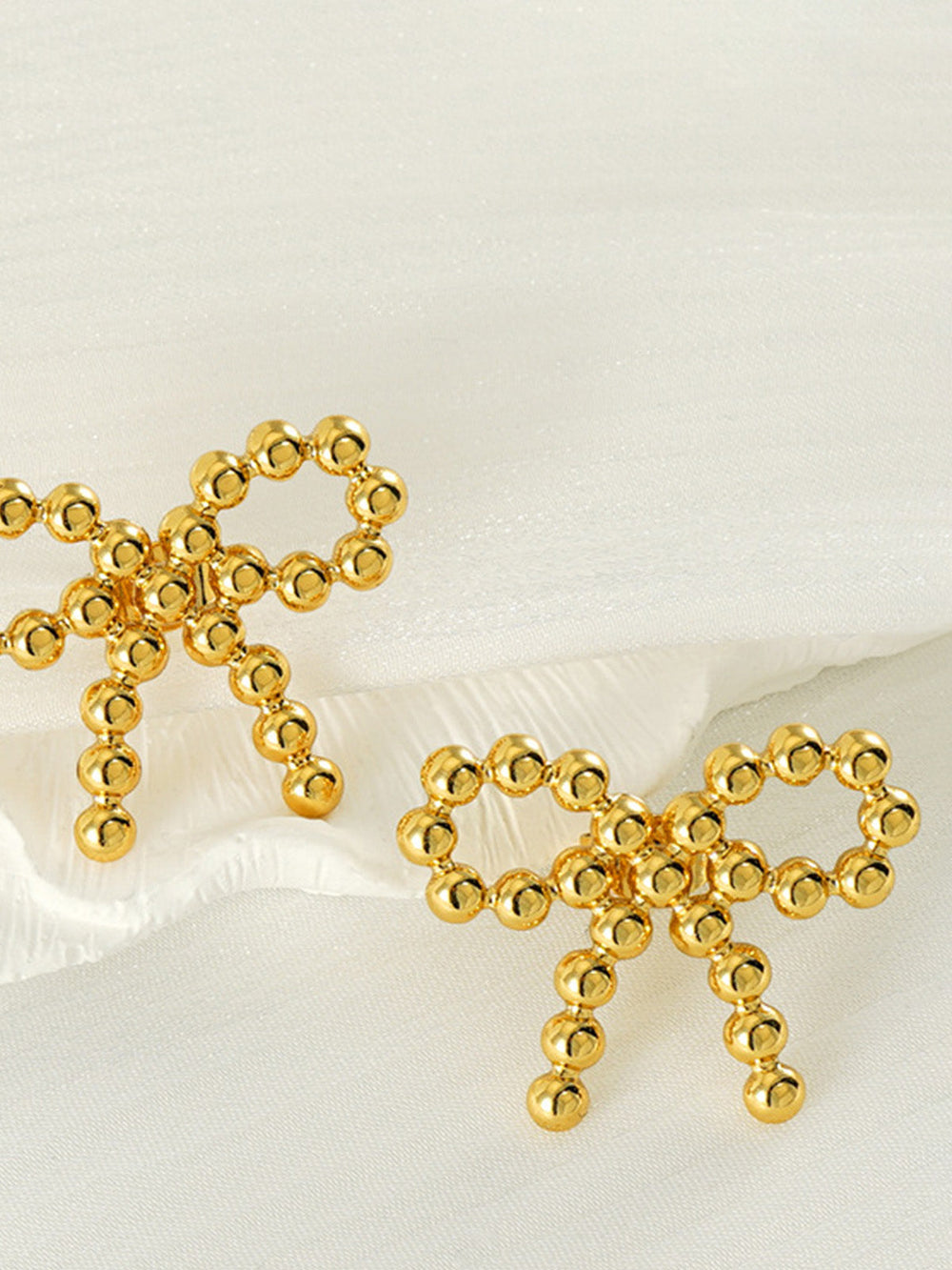 Boucles d'oreilles nœud perlé