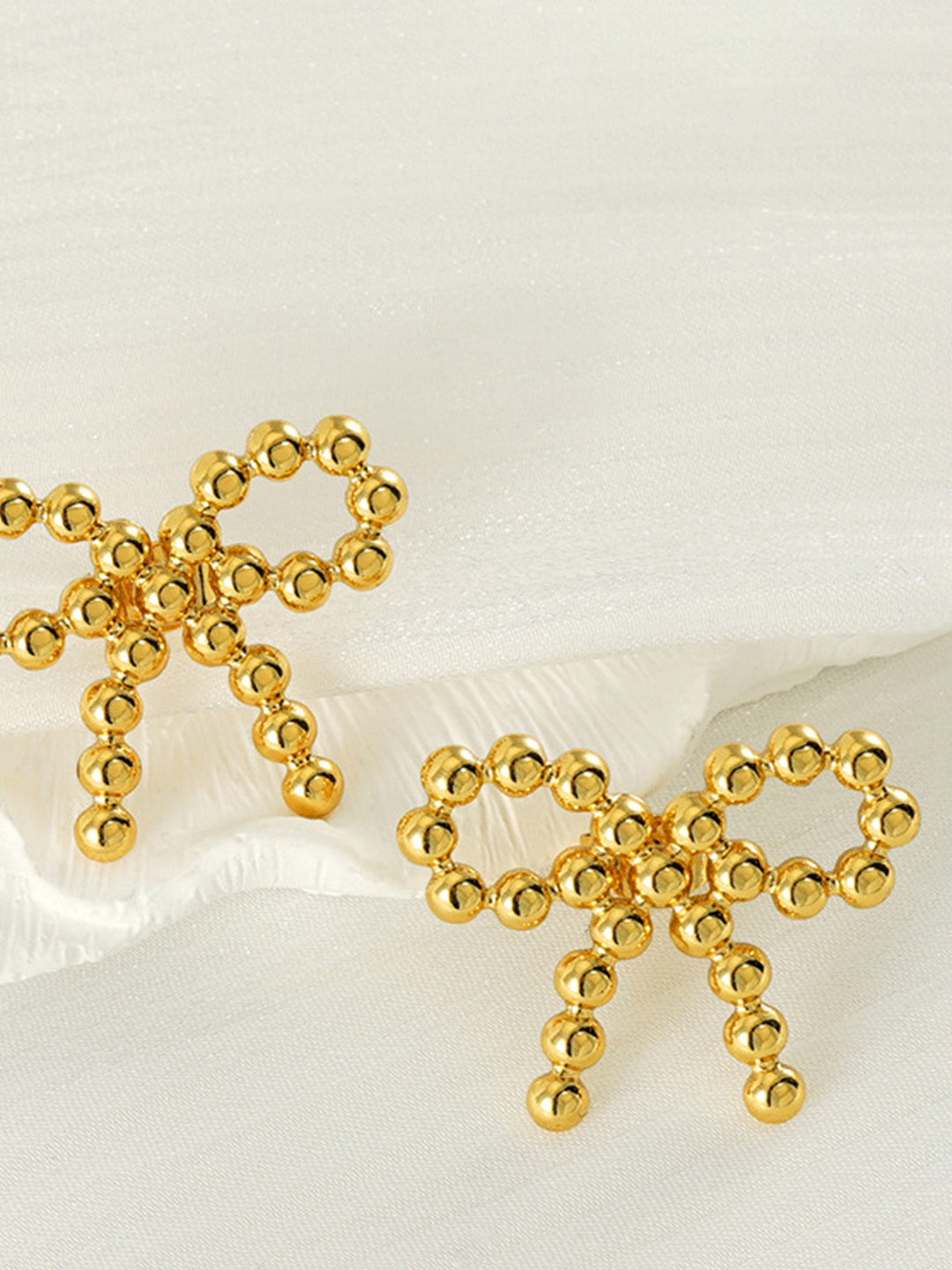 Boucles d'oreilles nœud perlé