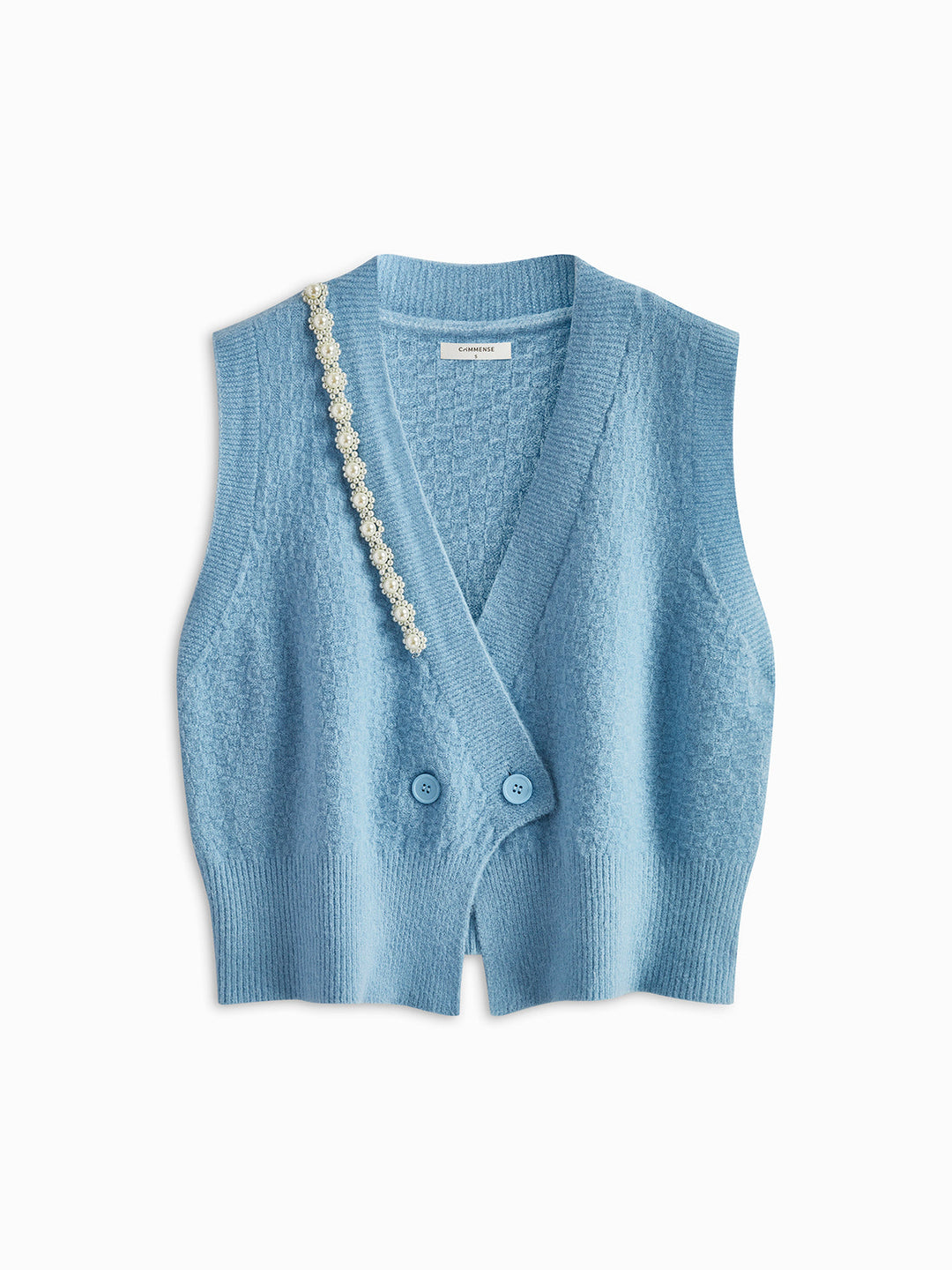 Gilet en tricot torsadé orné de perles