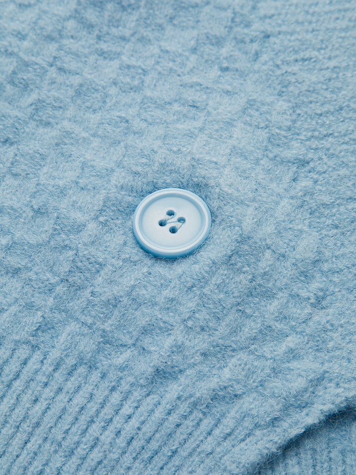 Gilet en tricot torsadé orné de perles