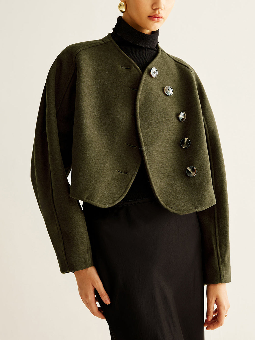 Manteau court asymétrique boutonné en tweed