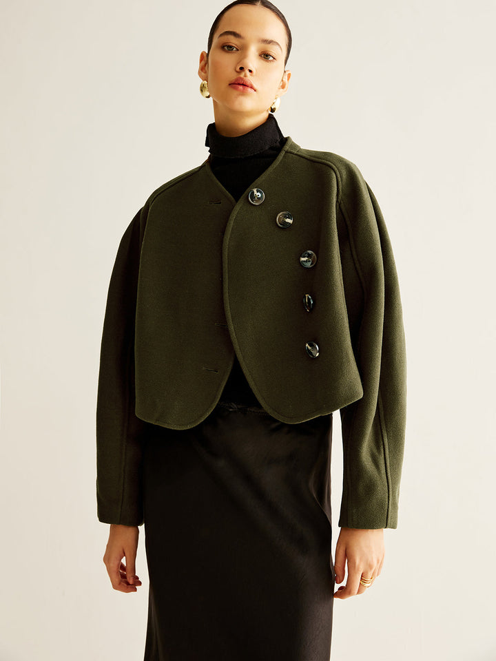 Manteau court asymétrique boutonné en tweed