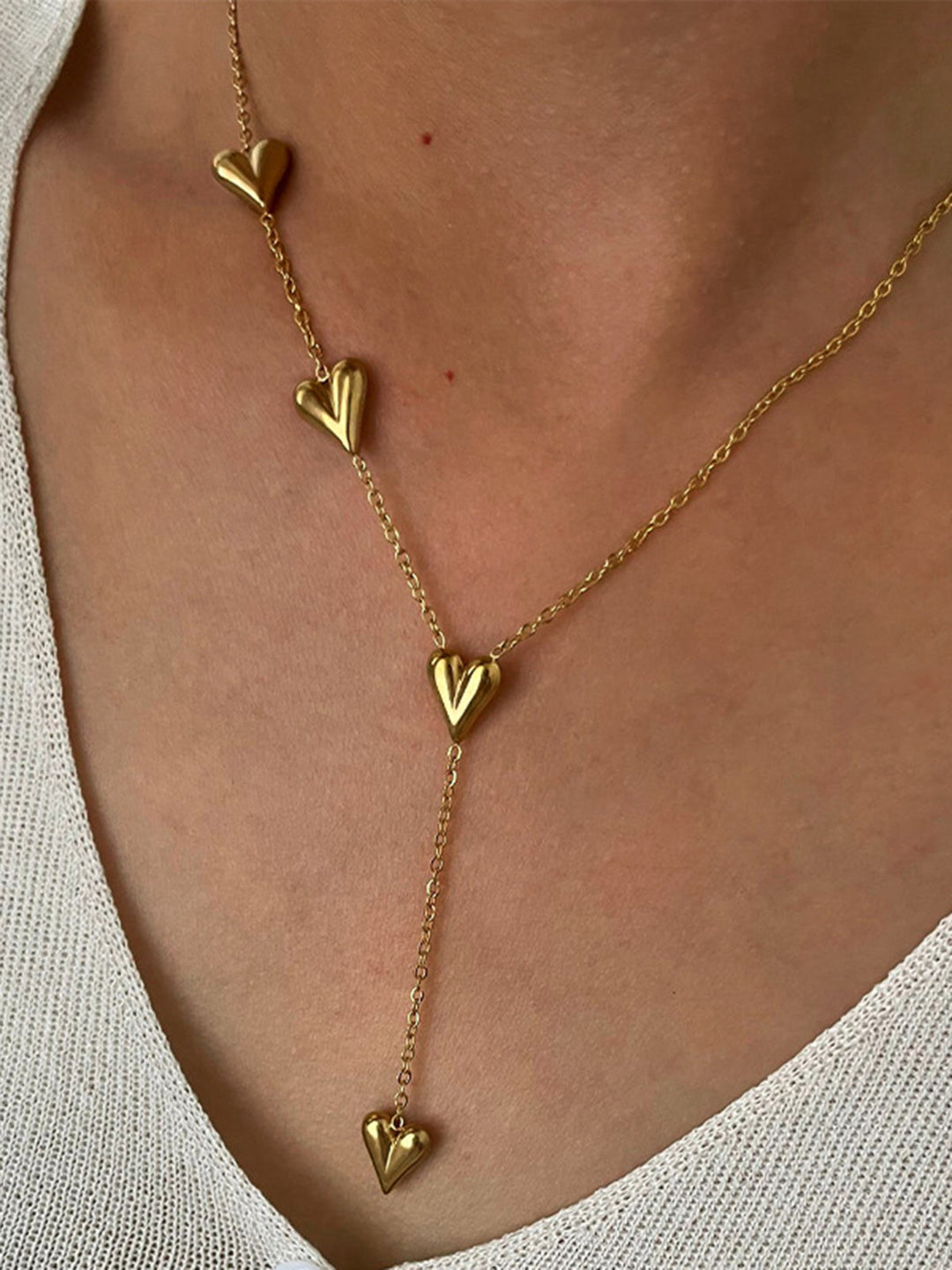 Collier à pompon en forme de cœur doré