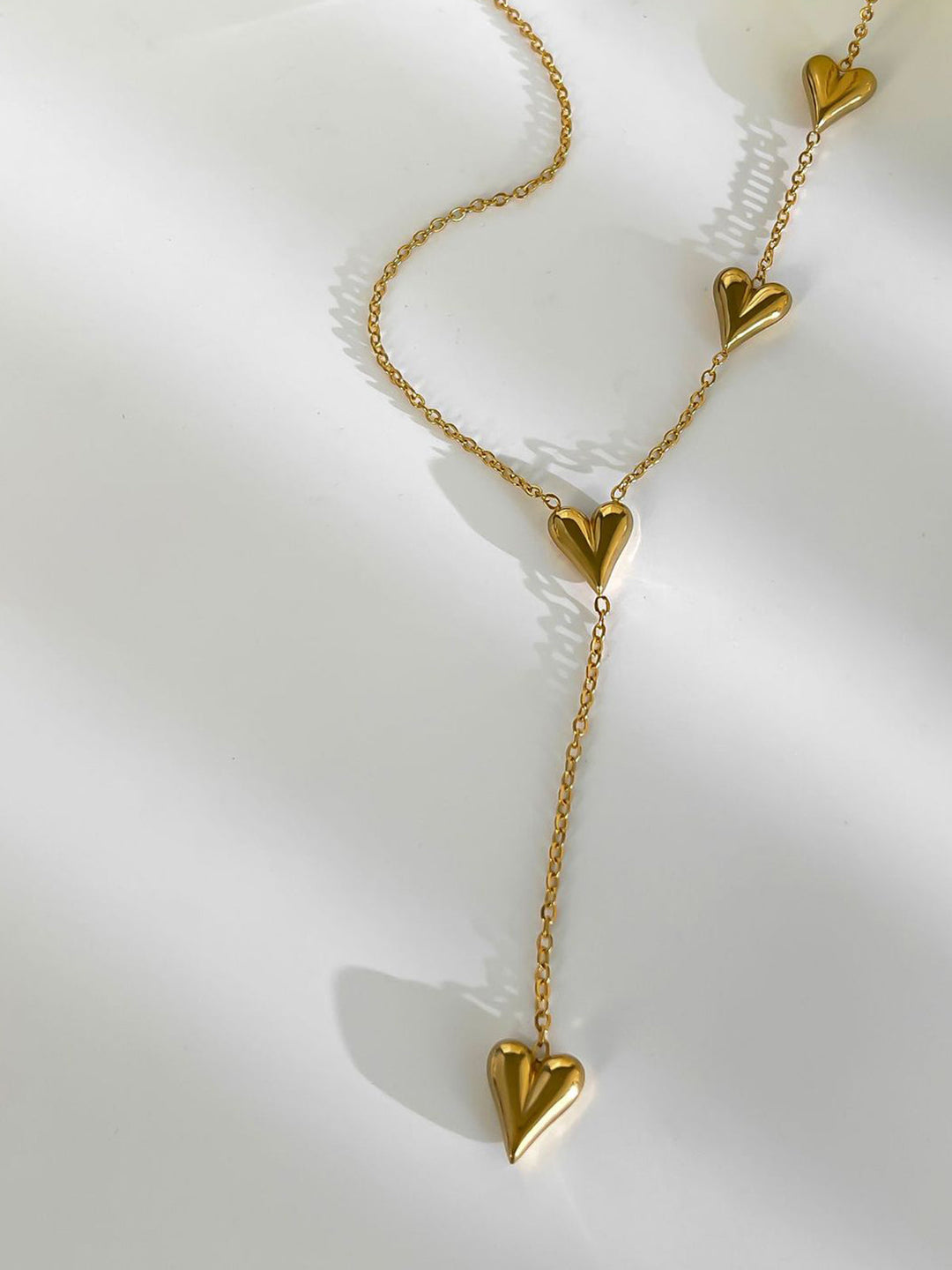 Collier à pompon en forme de cœur doré