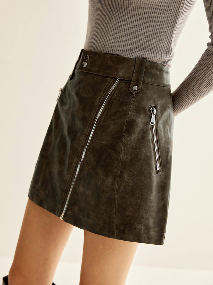 Jupe en cuir synthétique à poches asymétriques zippées