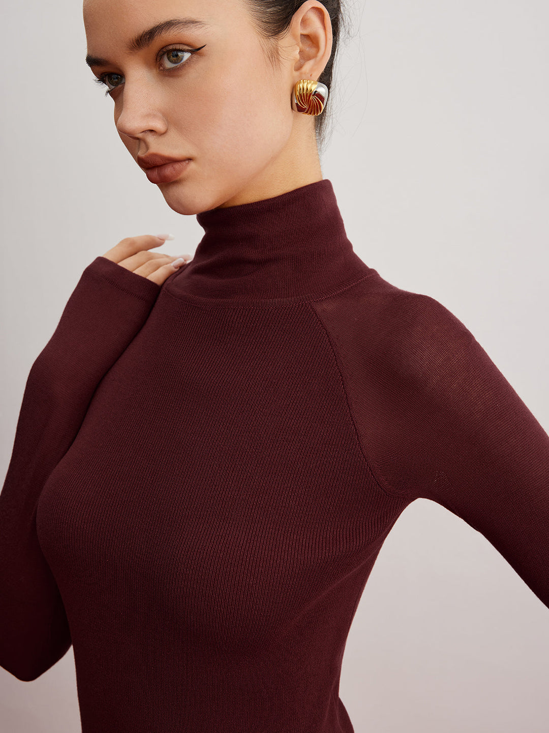 Pull ajusté à manches transparentes