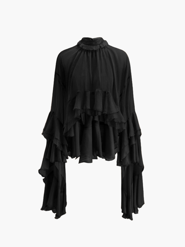 Blouse en mousseline à volants et col roulé transparent