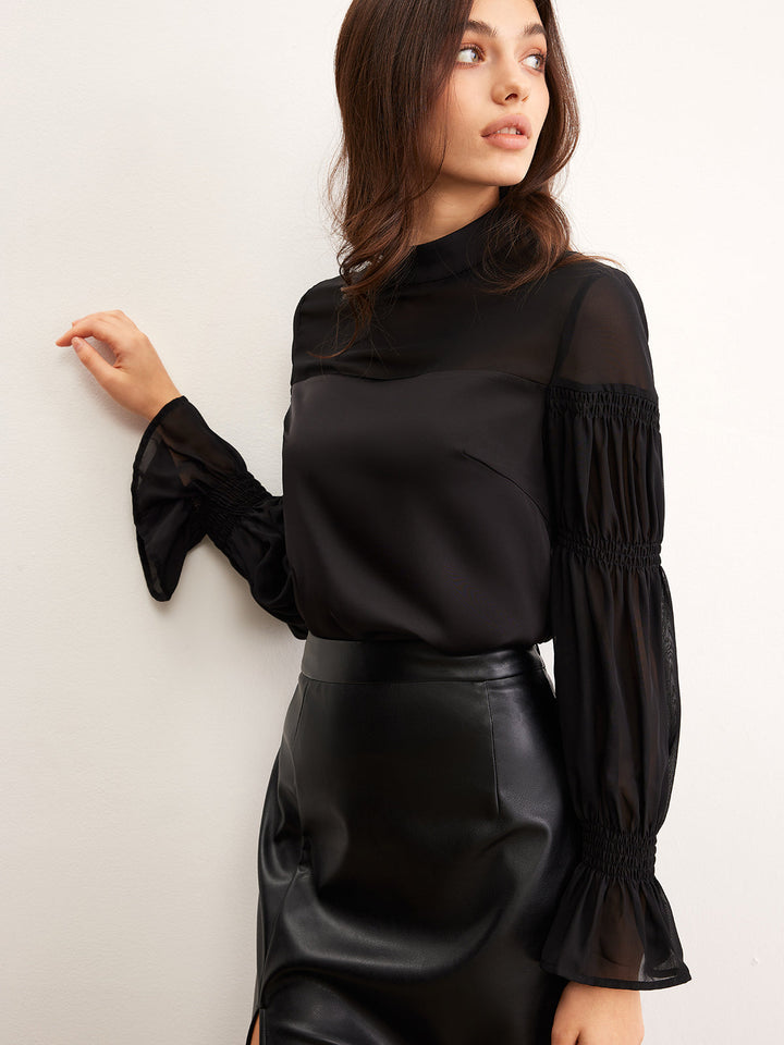 Blouse en mousseline à col montant