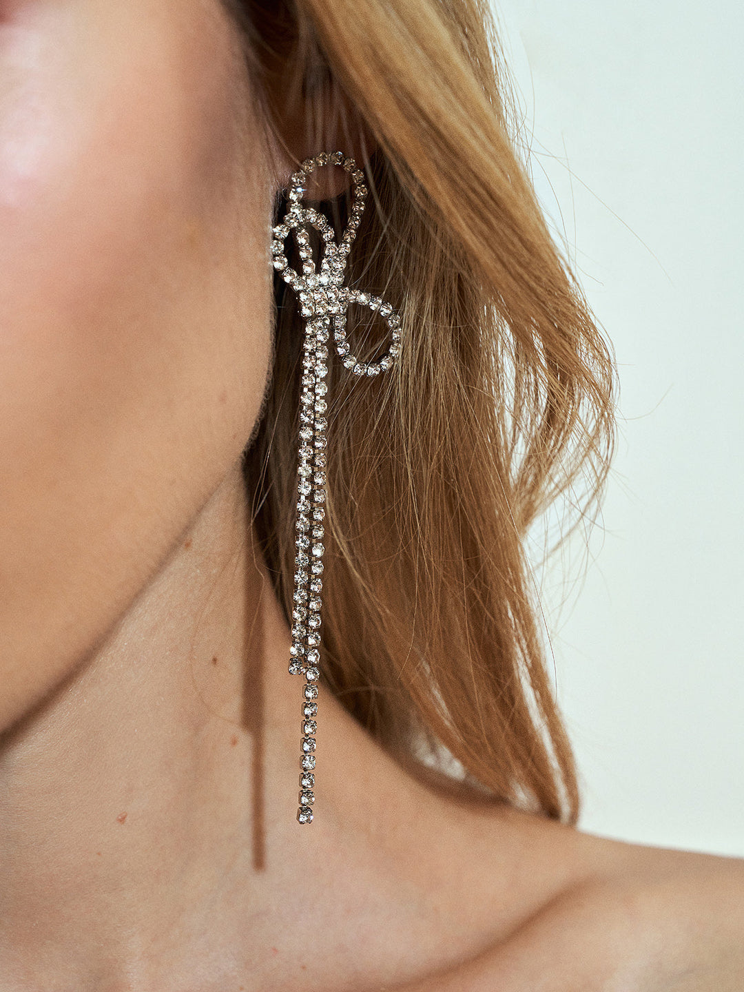 Boucles d'oreilles à franges avec nœud en strass