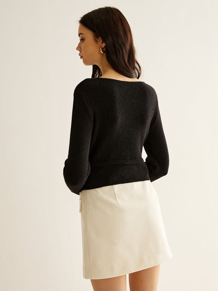 Pull en maille à col en V avec détails métalliques