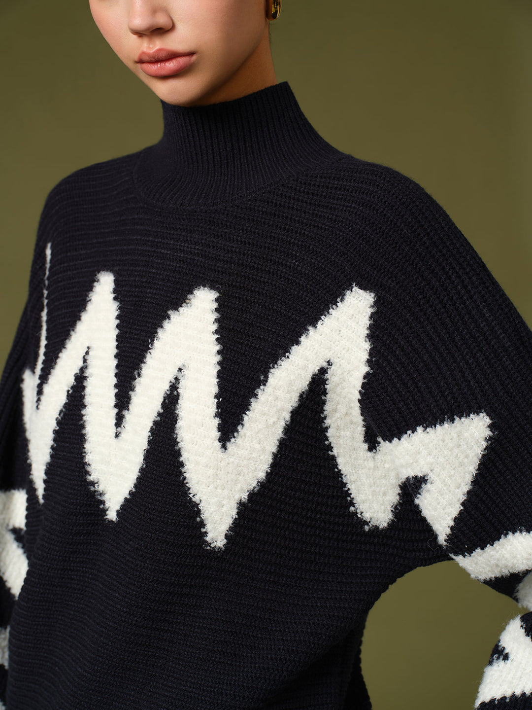 Pull à col roulé avec bordure contrastante
