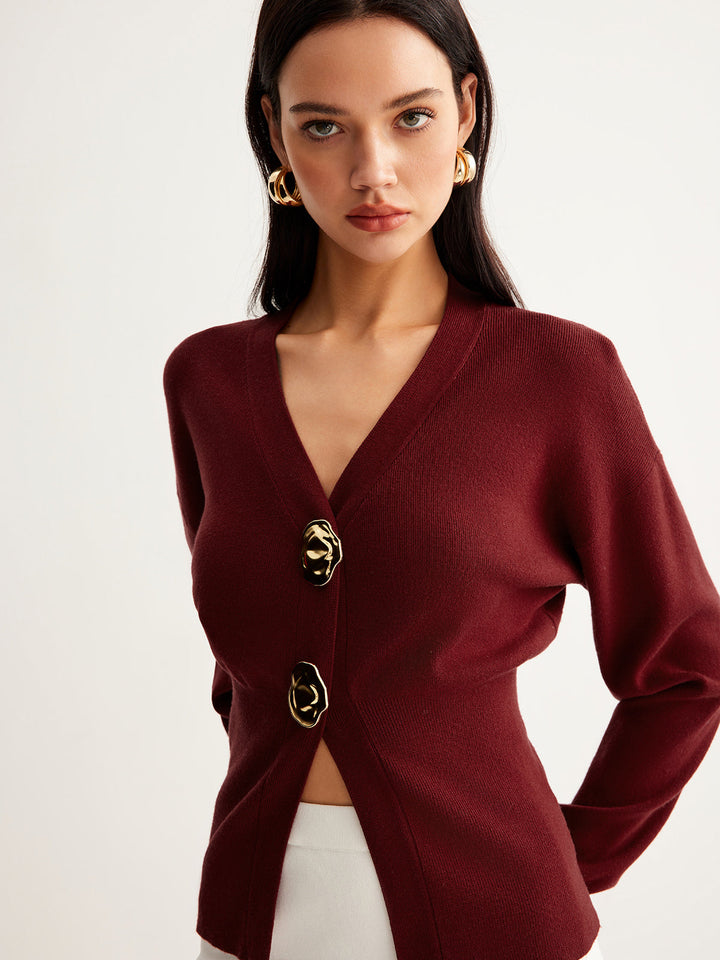 Pull coupe courte en tricot avec boutons métalliques fendus