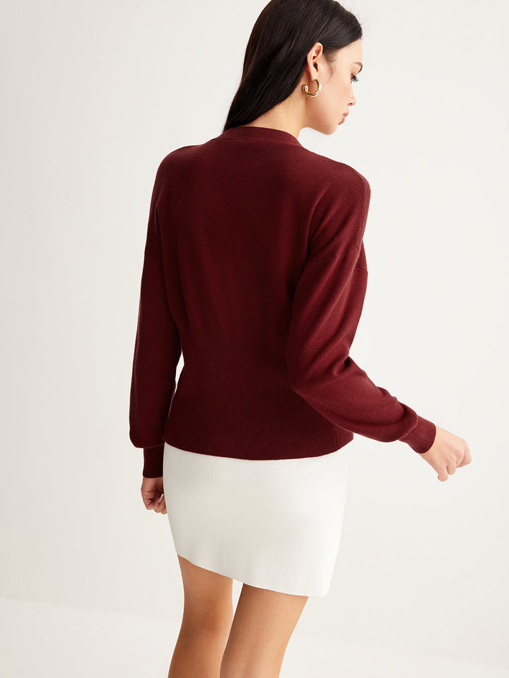 Pull coupe courte en tricot avec boutons métalliques fendus