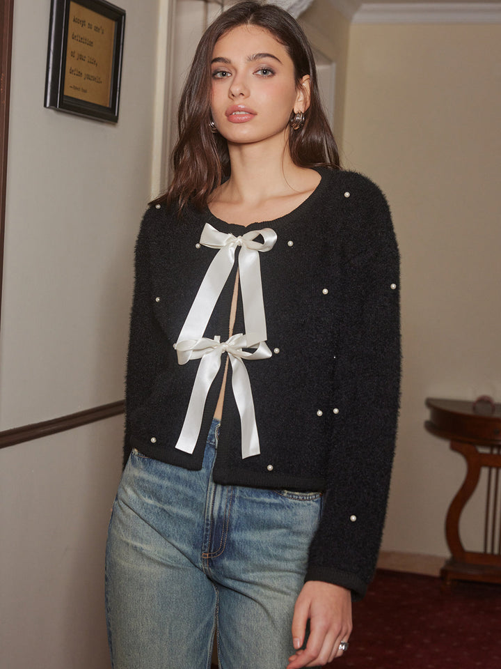 Haut en tricot avec nœud décoratif en perles