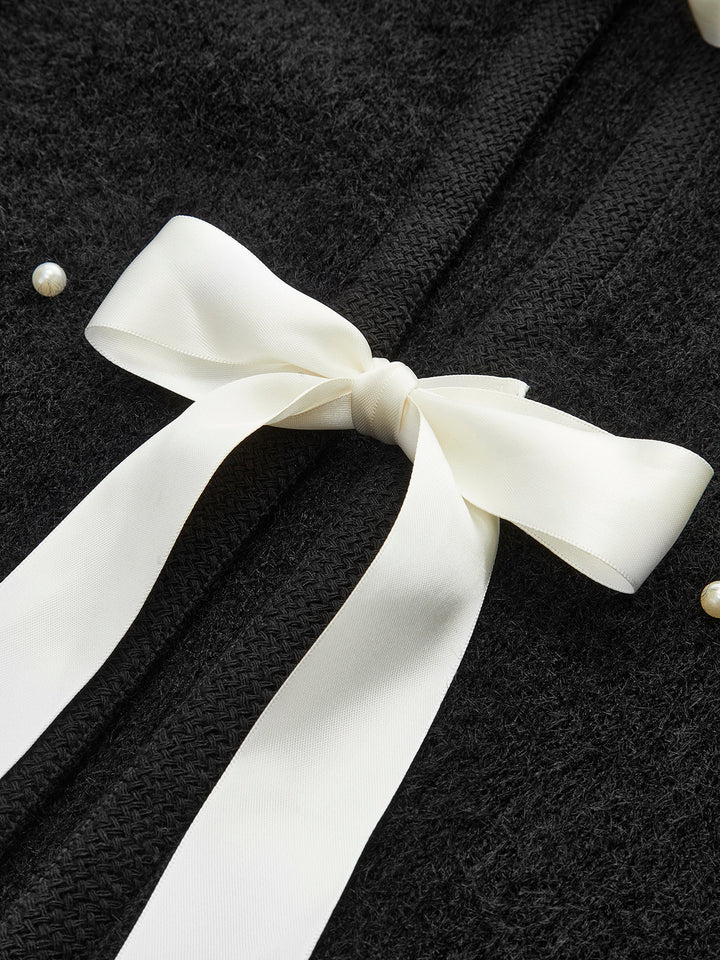 Haut en tricot avec nœud décoratif en perles