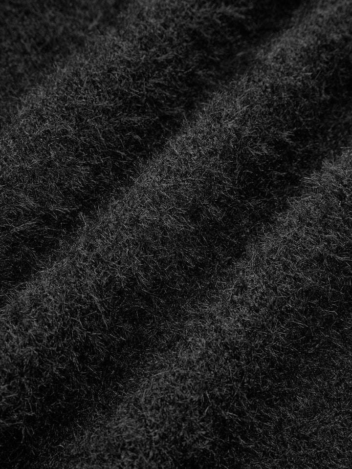 Haut en tricot avec nœud décoratif en perles