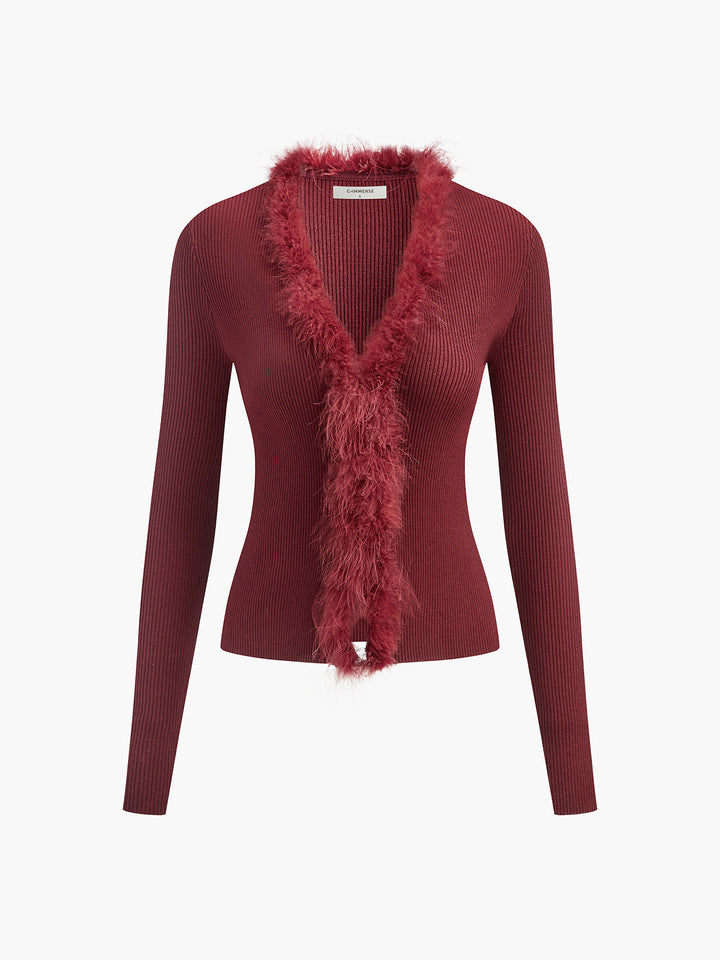 Pull ajusté en laine mélangée avec garniture en plumes