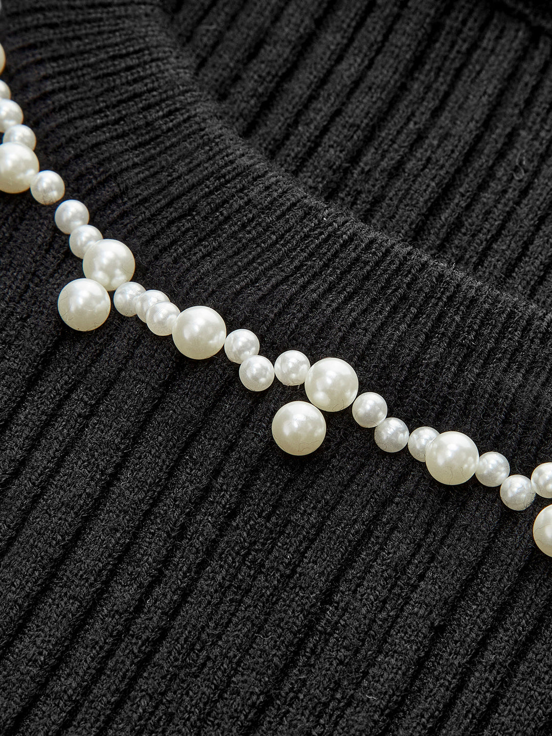 Haut en tricot à volants et perles