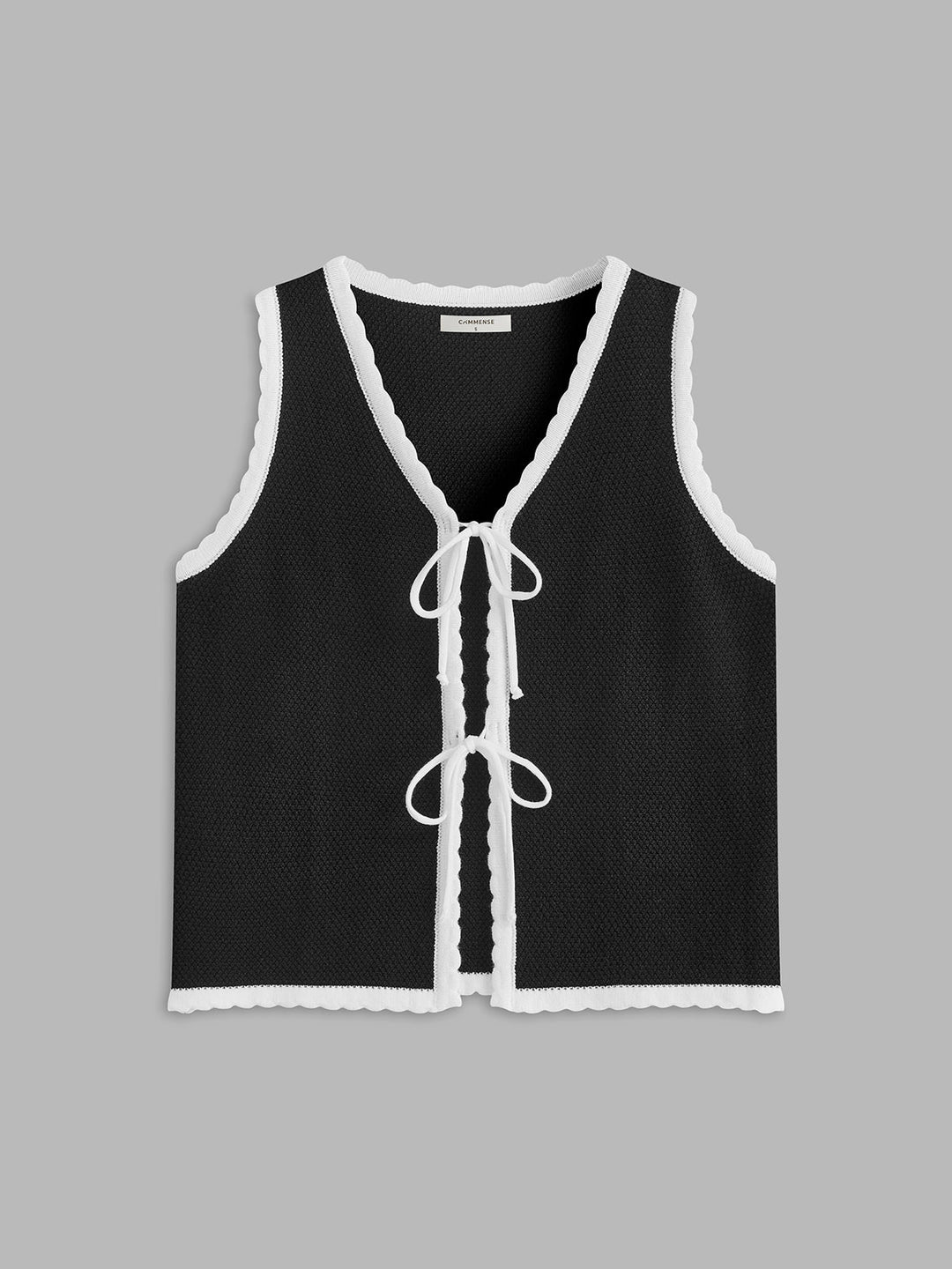 Gilet à bord festonné et fermeture à nouer