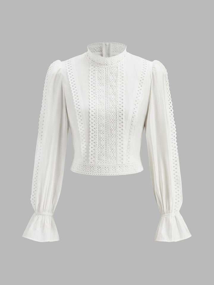 Blouse à col haut et manches bouffantes