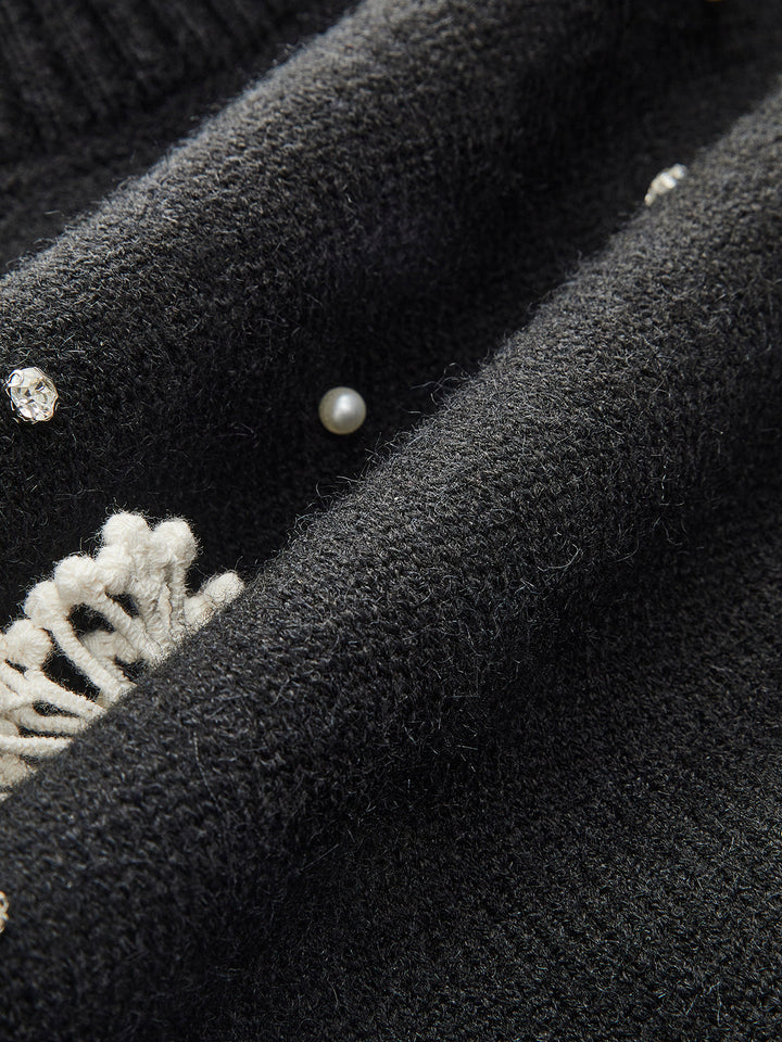 Gilet en tricot à boutonnage et rehaussement floral au dos