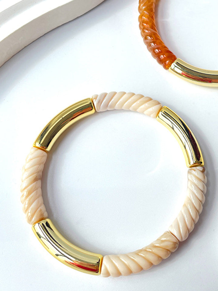 Bracelet jonc avec coquillage doré