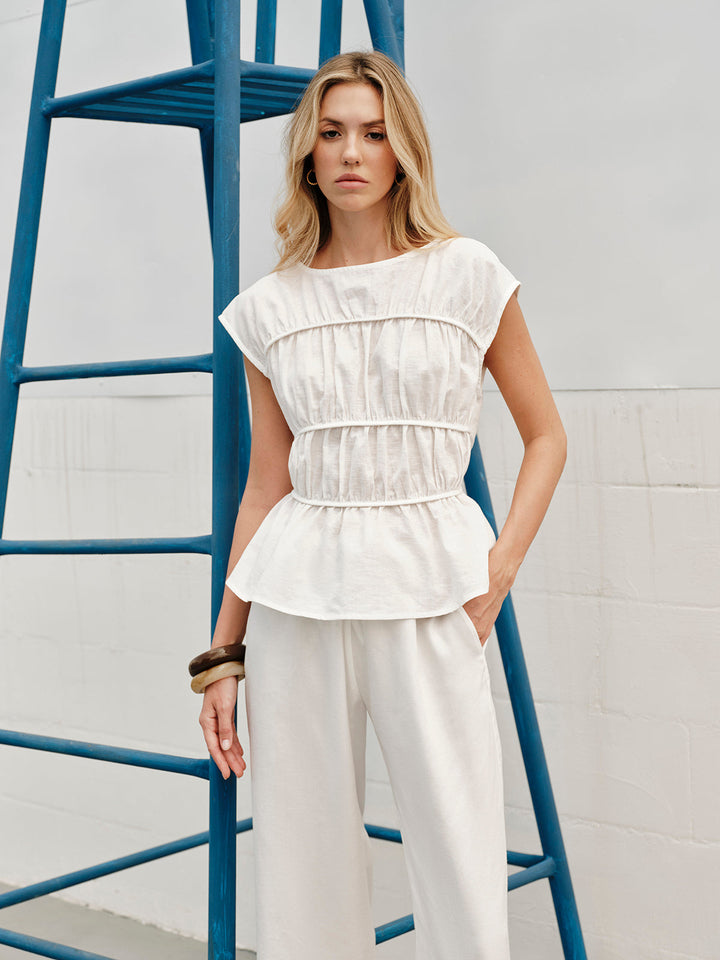 Blouse ample en lin semi-transparent à col rond