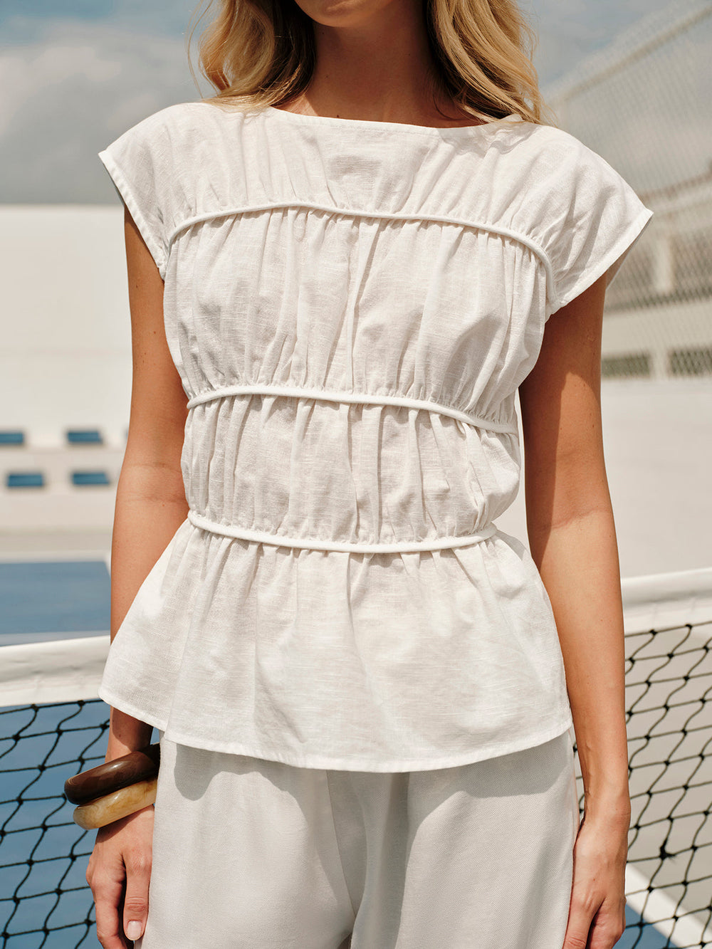Blouse ample en lin semi-transparent à col rond