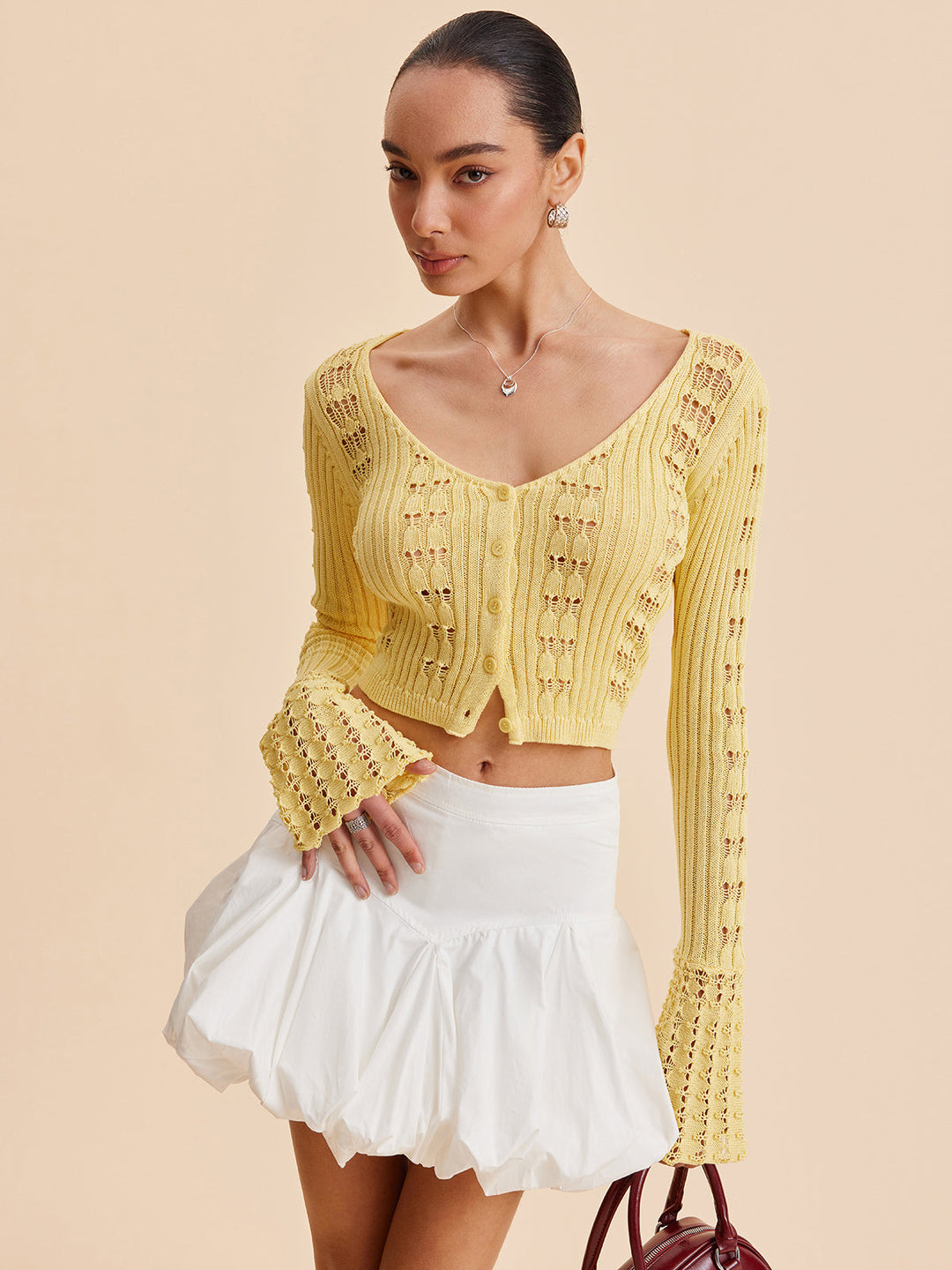Cardigan en maille crochet à manches cloche