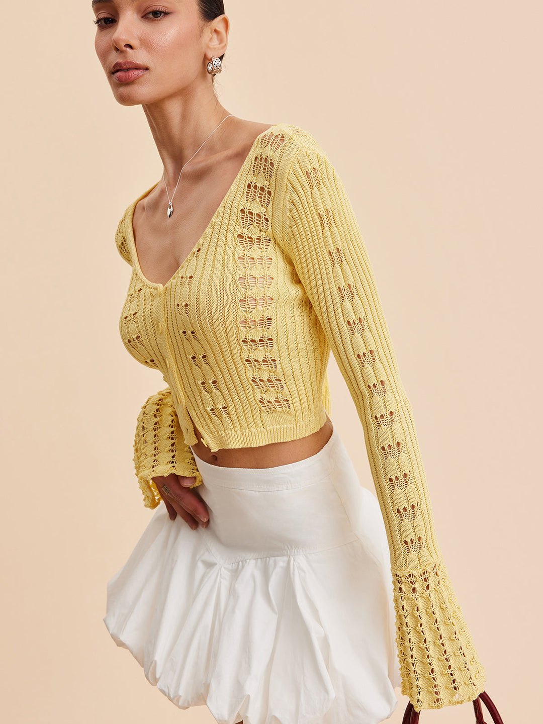 Cardigan en maille crochet à manches cloche