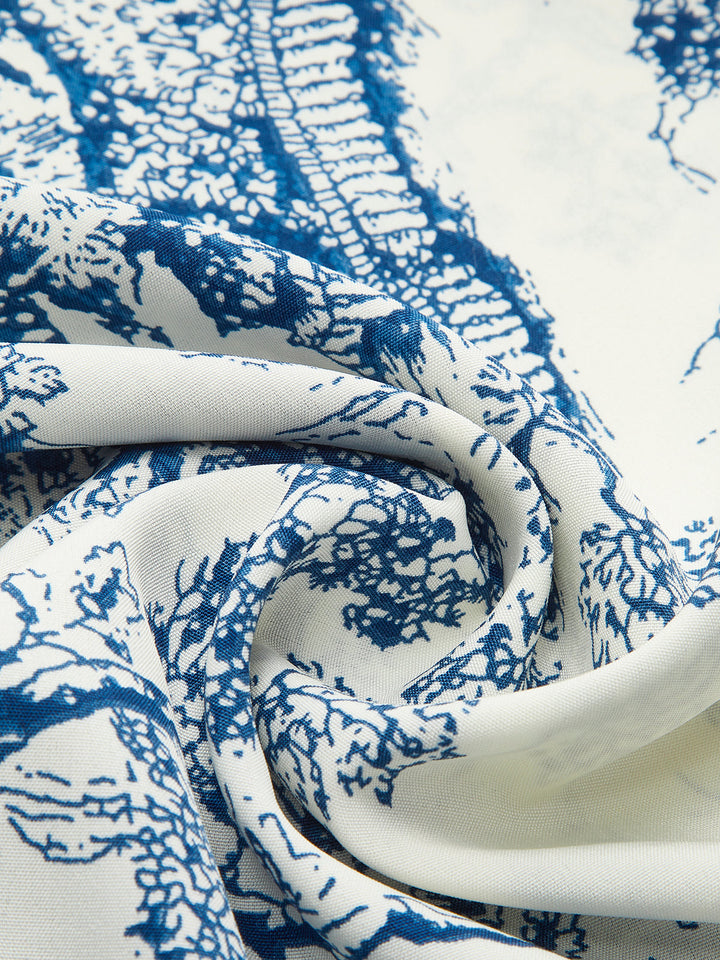 Robe imprimée à épaules dénudées et smockées