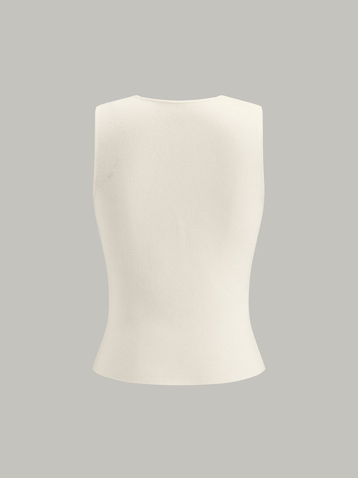 Gilet sans manches en maille à col en V avec détails métalliques