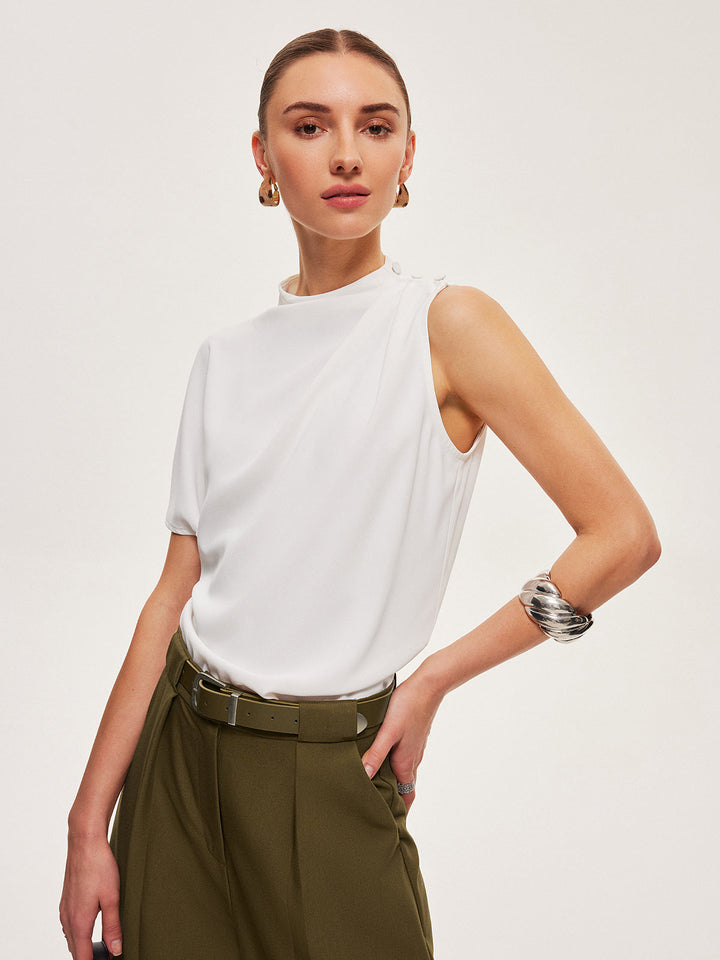 Haut à épaules boutonnées drapé asymétrique
