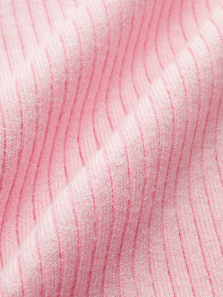 Haut en tricot asymétrique à bouton et col bénitier