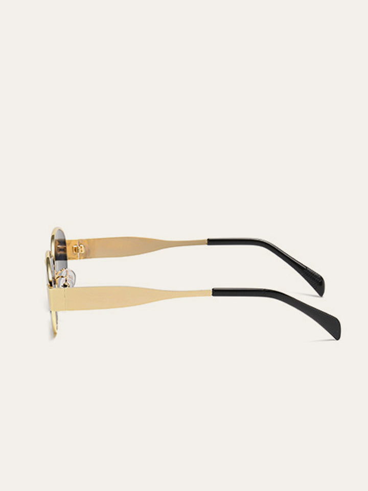 Lunettes de soleil ovales à bordure dorée