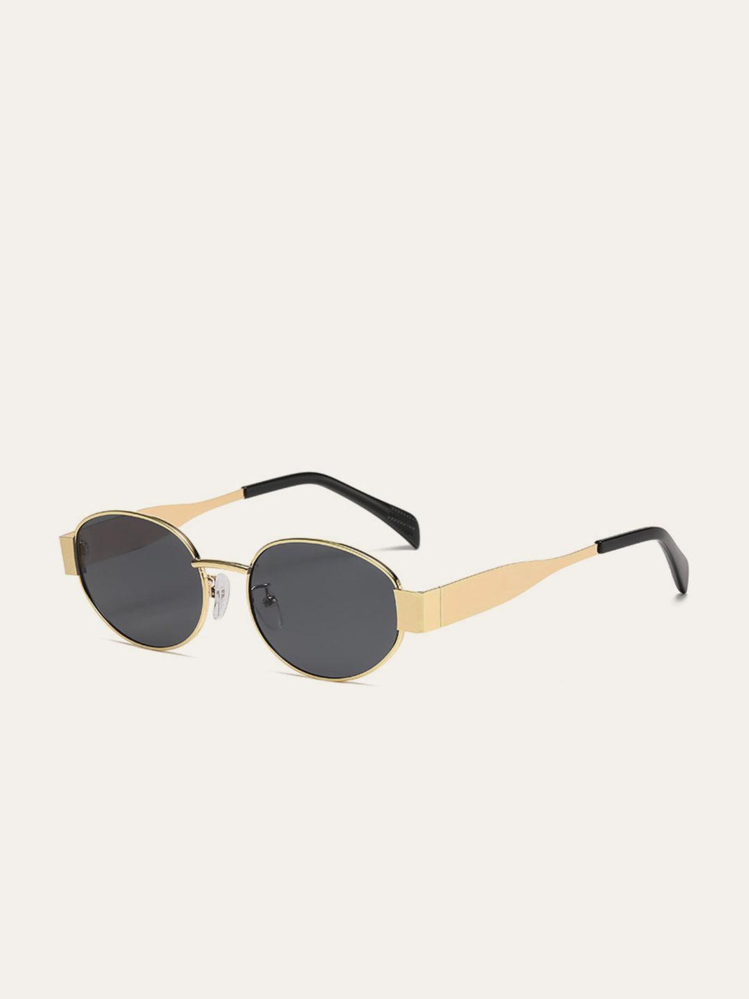 Lunettes de soleil ovales à bordure dorée