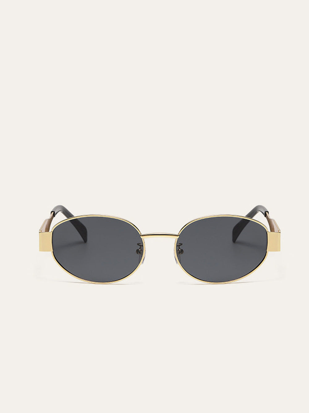 Lunettes de soleil ovales à bordure dorée