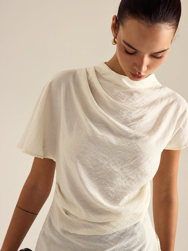 Blouse à col montant drapé