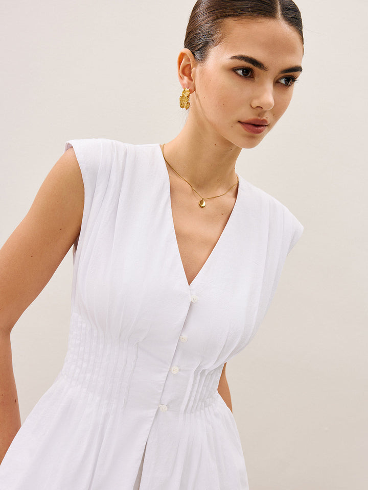 Blouse à col en V avec basque plissée